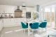 Modern white kitchen with blue accents - Newbury Racecourse, David Wilson Homes