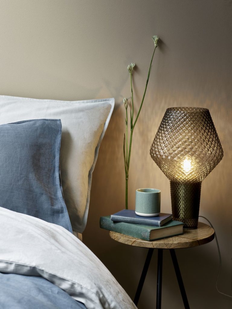 Debenhams Navy Linen Cotton Blend duvet set in a grey and pale blue colour with Khaleesi table lamp on a Brown Marble Swoon Pearl Side Table