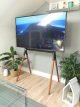 Minimalist black metal and wooden easel TV stand. TV Easel stand UK.