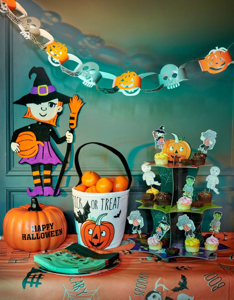 Bright and colourful pumpkin themed halloween party decorations.