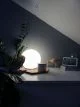 Ball shaped table lamp on sideboard