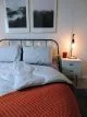 Soft coverless duvet with orange blanket and warm vintage-style LED lights