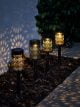 Solar Moroccan stake lights creating beautiful light patterns on the floor