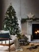 Christmas tree beside fireplace