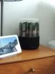 Briiv air purifier on a bedside table.