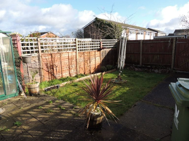 1970s house garden with small patio.