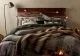 B&M Woodland Style collection with wooden headboard, plenty of soft bedding and lights.