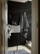 Black and white bathroom style with herringbone towels and zebra themed accessories from George Home at Asda.