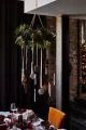 Hanging round wreath from ceiling with hanging LED candles.