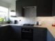 Modern kitchen with vibrant geometric tiles