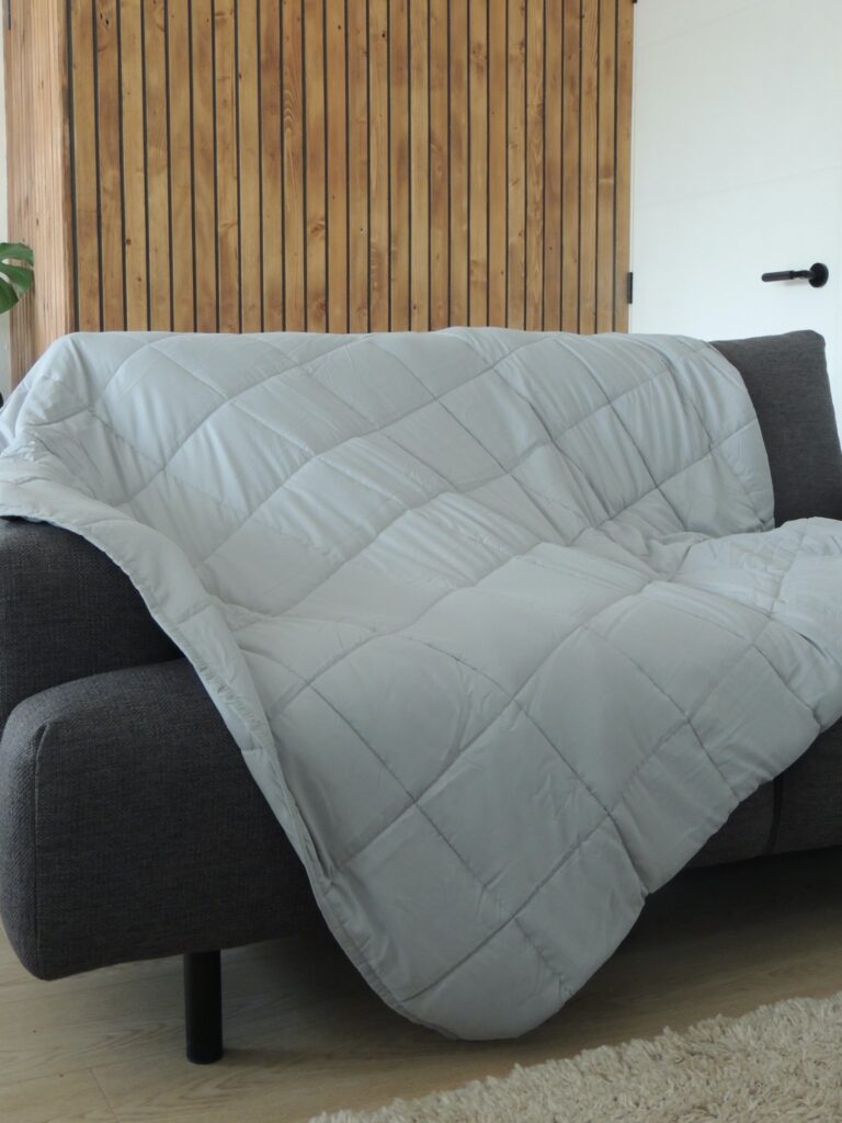 Light grey weighted blanket.