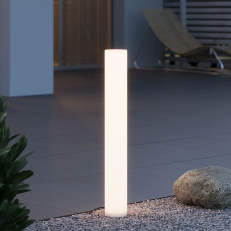Warm white glowing cylinder which is charged by a solar panel and lights up at night. The light is directed at all angles, giving a warm glow.
