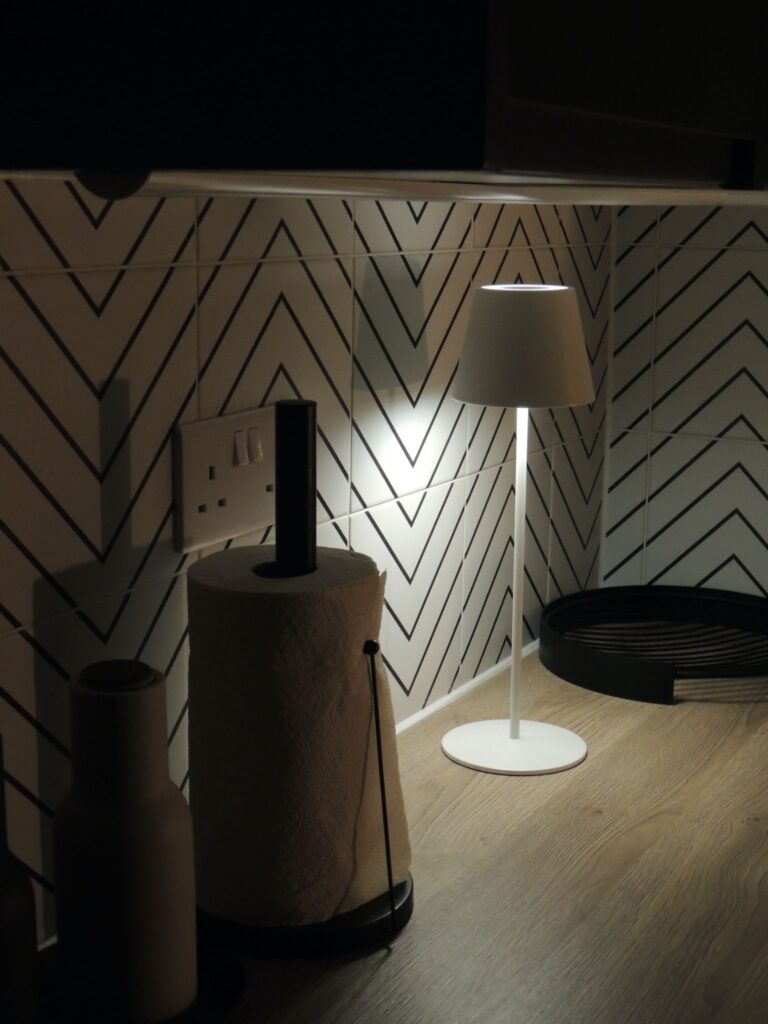 Portable table lamp in a kitchen.