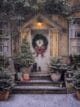 This charming house is all decked out for Christmas with a snowy porch, a festive wreath, and little Christmas trees.