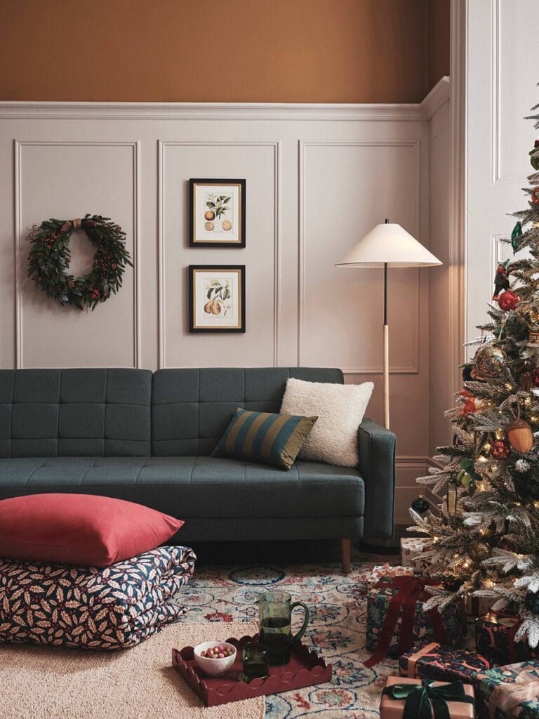 Cosy Christmas living room with a downswept snowy Christmas tree.